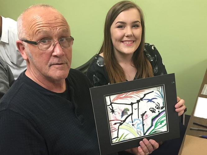 <p>Jack James High School student Stacey Stoinski with Dave Dougherty during the adult day program at Clifton Manor.</p>
